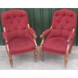 Pair of C19th rosewood open arm library chairs, with buttoned arched backs with scroll and lotus