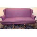 Queen Anne style sofa with wing back and outsplayed arms, on gilt angular S-scroll legs with bun