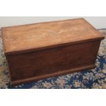 Victorian elm rectangular blanket box, with hinged lid and metal carry handles, on a skirted base,