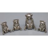 Group of four C20th continental white metal novelty seated teddy bear pepperettes, H6cm max (4)