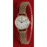 Omega - lady's 9ct gold hand wound wristwatch, signed silvered dial with applied hours and outer