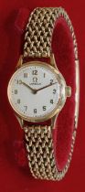 Omega - lady's 9ct gold hand wound wristwatch, signed silvered dial with applied hours and outer
