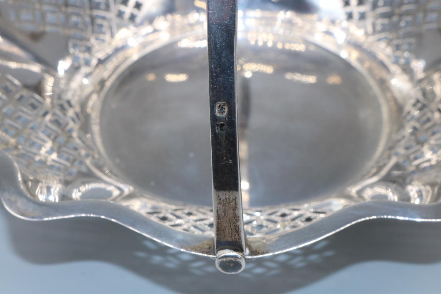 George V hallmarked silver circular cake basket, with geometrically pierced tapering sides and - Image 3 of 3