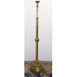 C20th brass standard lamp, adjustable column on lobed stepped circular base and three bun feet,