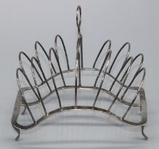 George 111 hallmarked silver wirework seven bar toast rack, with loop handle on shaped base with