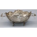 Late C19th Continental silver two handled oval bon bon dish, repousse with scrolls and buildings, on