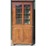 George 1V mahogany corner cabinet, stepped cornice and two astragal moulded glazed doors above two
