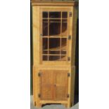 Alan Acornman Grainger, Acorn Industries Brandsby - an adzed oak standing corner cabinet, with