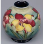 Moorcroft Pottery: African Lily pattern globular vase, tubelined decoration of pink and yellow