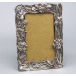 Unmarked white metal Art Nouveau rectangular easel photograph frame, relief decorated with