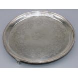 George 111 hallmarked silver circular salver, engraved with a band of shell and scrollwork within