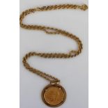 Geo.V 1928 sovereign in 9ct yellow gold mount, stamped 375, on 9ct yellow gold rope twist chain,