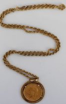Geo.V 1928 sovereign in 9ct yellow gold mount, stamped 375, on 9ct yellow gold rope twist chain,