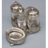 Victorian hallmarked silver four piece cruet stand, basket weave trefoil base with twist handle on