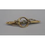 15ct yellow gold brooch set with single pale blue stone and seed pearls, stamped 15, 2.3g