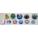 Eight Caithness glass paperweights: Weathervane, Floral Illusion, Mini Moonflower x4, Mooncrystal,