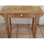 C20th pine side drawer side table, on four turned legs, H67cm, W90cm, D44cm