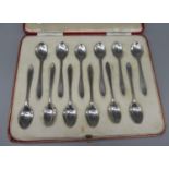 Cased set of twelve George V1 hallmarked silver coffee spoons, Rd. 770611, by Thomas Bradbury & Sons