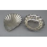 Late Victorian hallmarked silver shell shaped butter dish on three ball feet, by Goldsmiths and