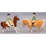 Beswick figures: boy on palomino pony No. 1500, and a girl on a skewbald pony No. 1499, max. H14.5cm