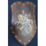 C18th iron shield embossed with painted figure of St George and the dragon with bossed detail to the