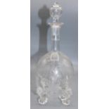 C19th Stourbridge type decanter, blown stopper, wheel cut botanical decoration on four scroll feet