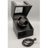 Black leather watch winder with contrasting white stitching W12cm D13cm H16.5cm