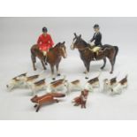 Beswick Hunting group comprising huntsman on horseback, huntswoman on horseback (a/f), 8 hounds