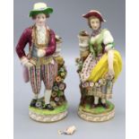 Pair of C19th Continental porcelain models of lady and gentleman gardeners, both in C18th dress with