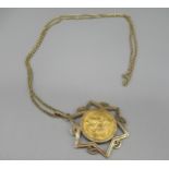 Geo.V 1927 sovereign mounted in yellow metal star pendant mount, on 9ct yellow gold belcher chain,