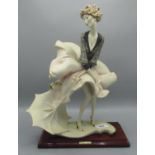 Florence/Giuseppe Armani figurine of a girl with umbrella, manufacturer's mark to the base, H37cm