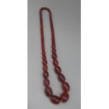 String of amber/ Bakelite style beads