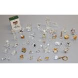 Large collection of Swarovski Crystal glass ornaments, including: cactus; coffee grinder; globe;