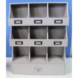 Grey painted wall mounted storage cabinet with nine compartments and drawer, W46cm D14, H670cm