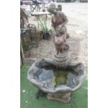 Composition garden water feature, cast as a female water carrier seated by a shell, H120cm W65cm