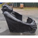 Unfinished fibre glass fairground ride gondola in the form of a Gothic dragon