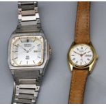 Seiko SQ 100 stainless steel quartz wristwatch with day date, signed brushed octagonal dial,