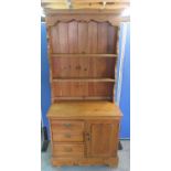Small Victorian and later pine dresser, two tier back above three drawers and panel door, on skirted