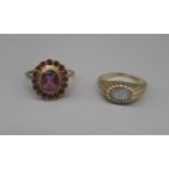 9ct yellow gold cluster ring set with purple stones, size K, and another 9ct gold ring set with pale