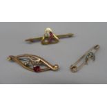 9ct yellow gold brooch with floral decoration set with red stone and seed pearls, stamped 9c, a