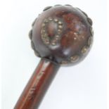 African hardwood knobkerrie, globular head set with metal studs, H72cm