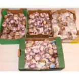 Large collection of carved souvenir cowrie shells (4 boxes)