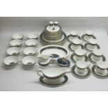 Royal Doulton Carlyle pattern tea and dinner wares to include. cups and saucers, milk jug, side