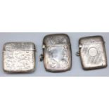 Three Edward V11 and later hallmarked silver vesta cases with engine turned and scroll decoration,