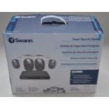 As new/factory sealed Swann Smart Security System for home or business with expandable 4 camera