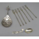 C19th Dutch silver caddy spoon, bowl with figure in relief, hooked handle with cockrel finial,