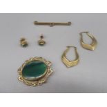 Pair of 9ct yellow gold shaped hoops with grooved detail, stamped 375, a 9ct gold brooch set with