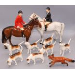 Beswick hunting figures: standing huntsman on bay horse, huntswoman on dapple grey horse, fox, and