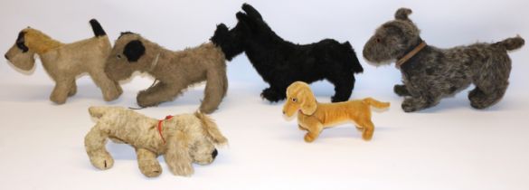 Five vintage toy dogs including a Chiltern golden spaniel, and a modern Steiff dachshund