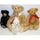 Four modern collectable teddy bears, comprising a Robin Rive bear with black fur, Dean's Rag Book